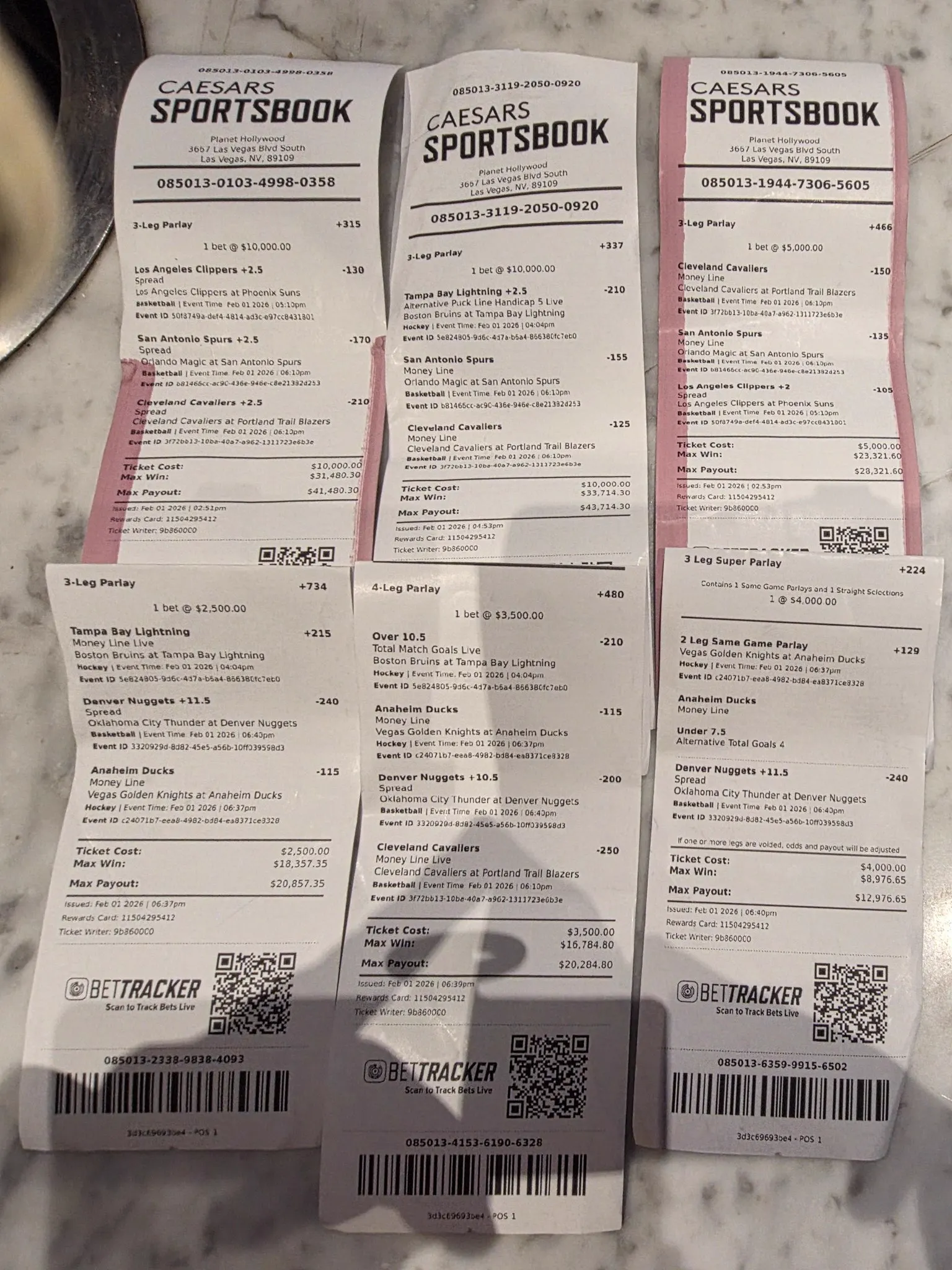Caesars sportsbook ticket stack, six winning slips