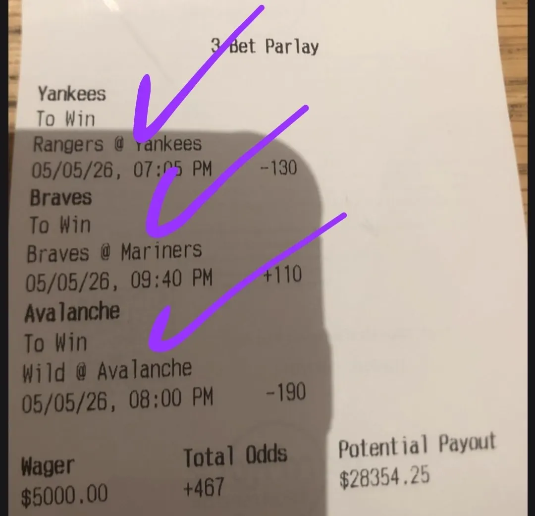 Marked three-bet parlay ticket with circled potential payout