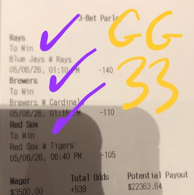 Marked three-bet parlay ticket with circled potential payout
